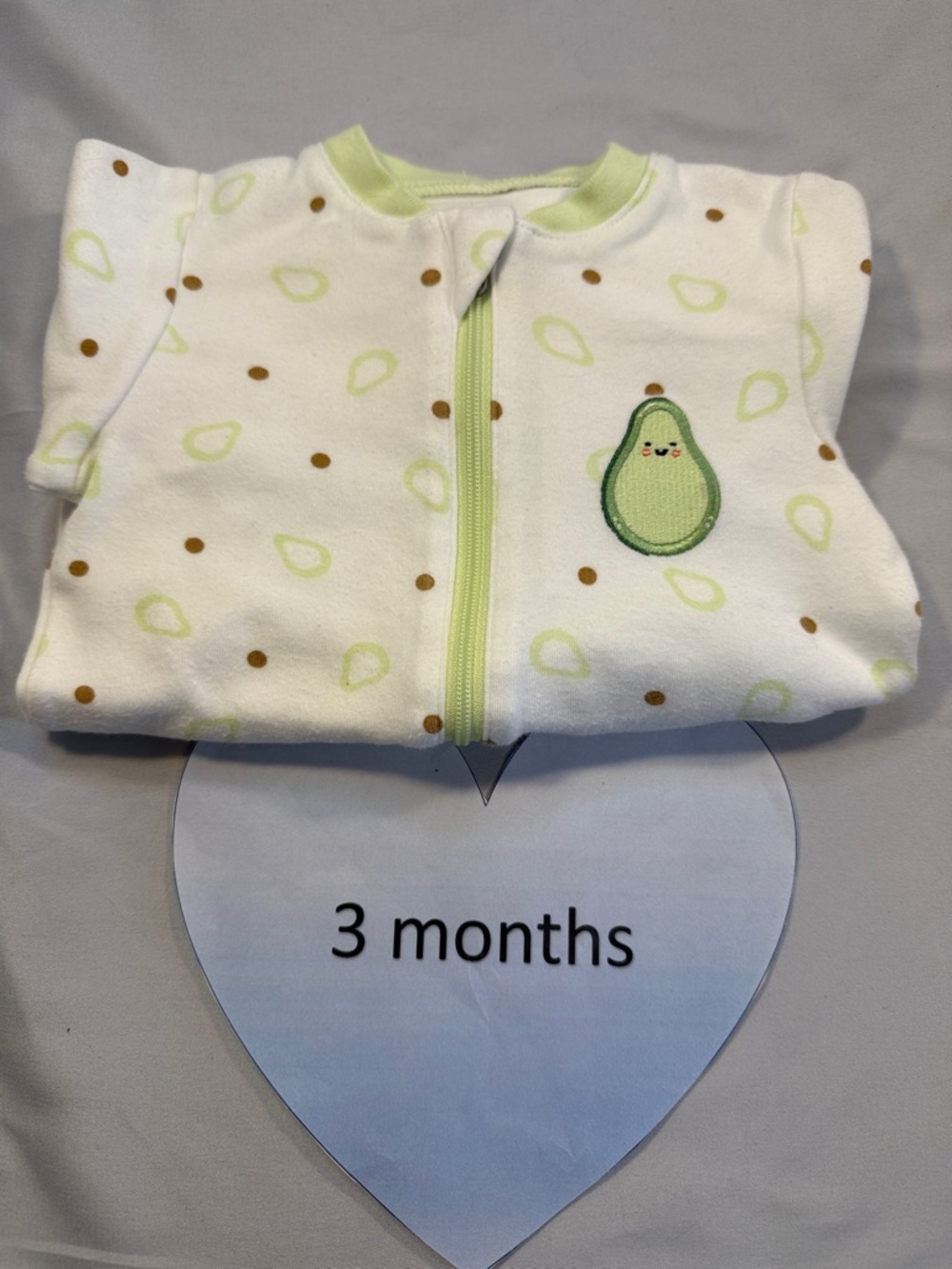 Tuffy White Baby Onesie with Green Trim and embroidered avocado